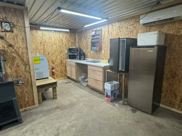 a kitchen with refrigerator and window