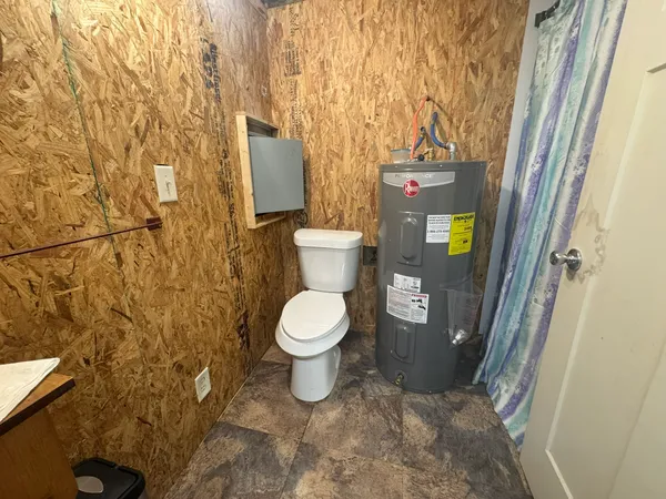 a bathroom with a toilet and a sink