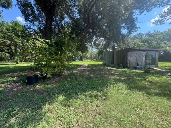 a backyard of a house with lots of green space