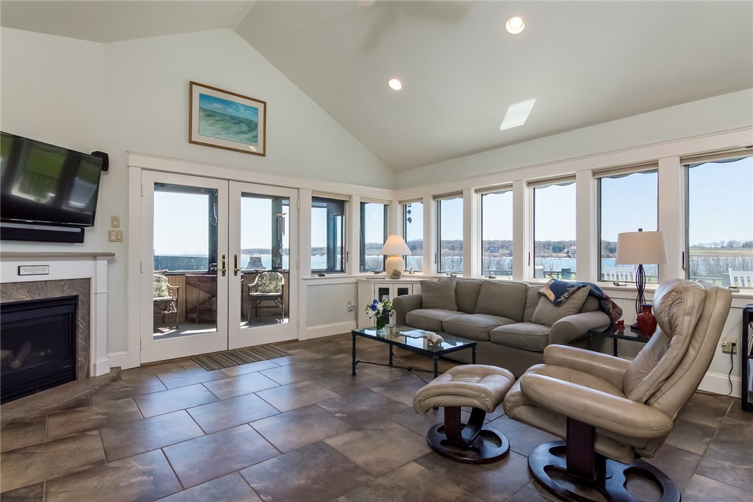 7 Beavertail Road Jamestown, RI 02835 - Photo 20 of 37 A tile floor in the family room (with a gas fireplace and radiant heat for the colder weather) allows worry-free trips to and from the beach
