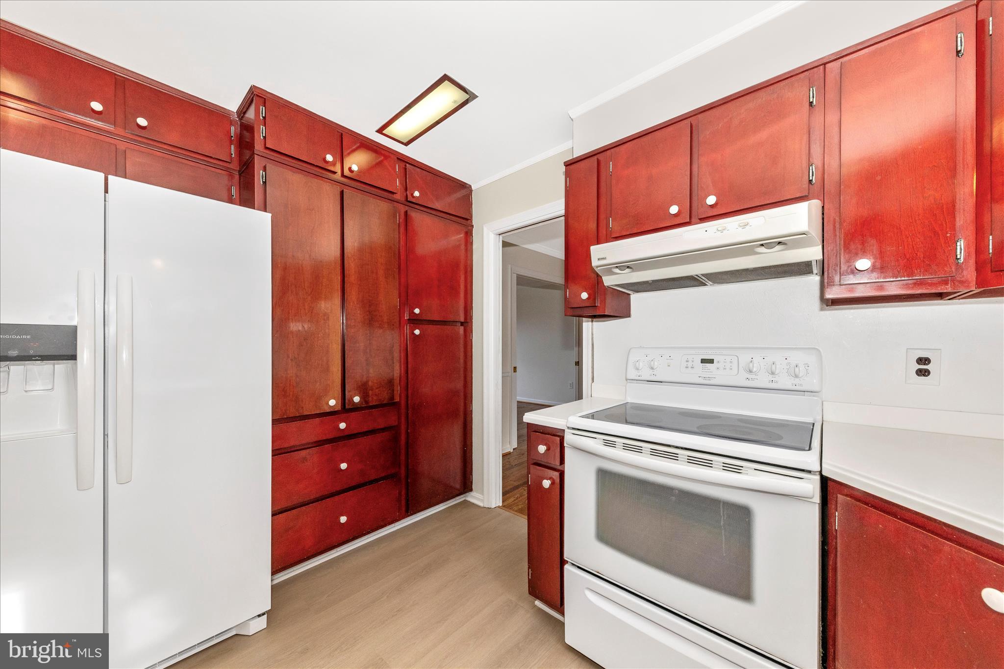 5815 Meadow Road Frederick, MD 21702 - Photo 15 of 55 a kitchen with a stove and a microwave oven