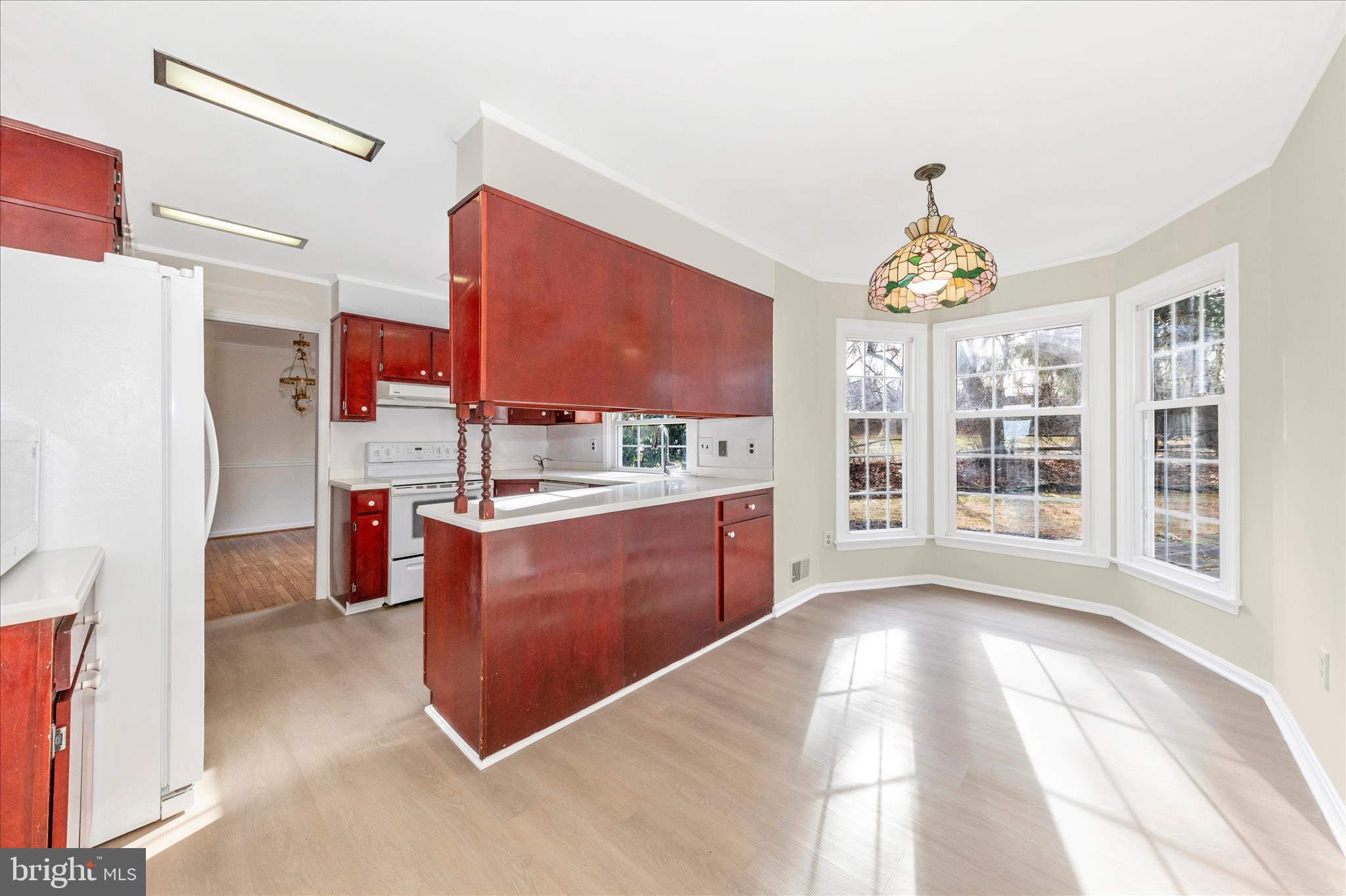 5815 Meadow Road Frederick, MD 21702 - Photo 17 of 55 a kitchen with stainless steel appliances kitchen island granite countertop a refrigerator and a stove top oven