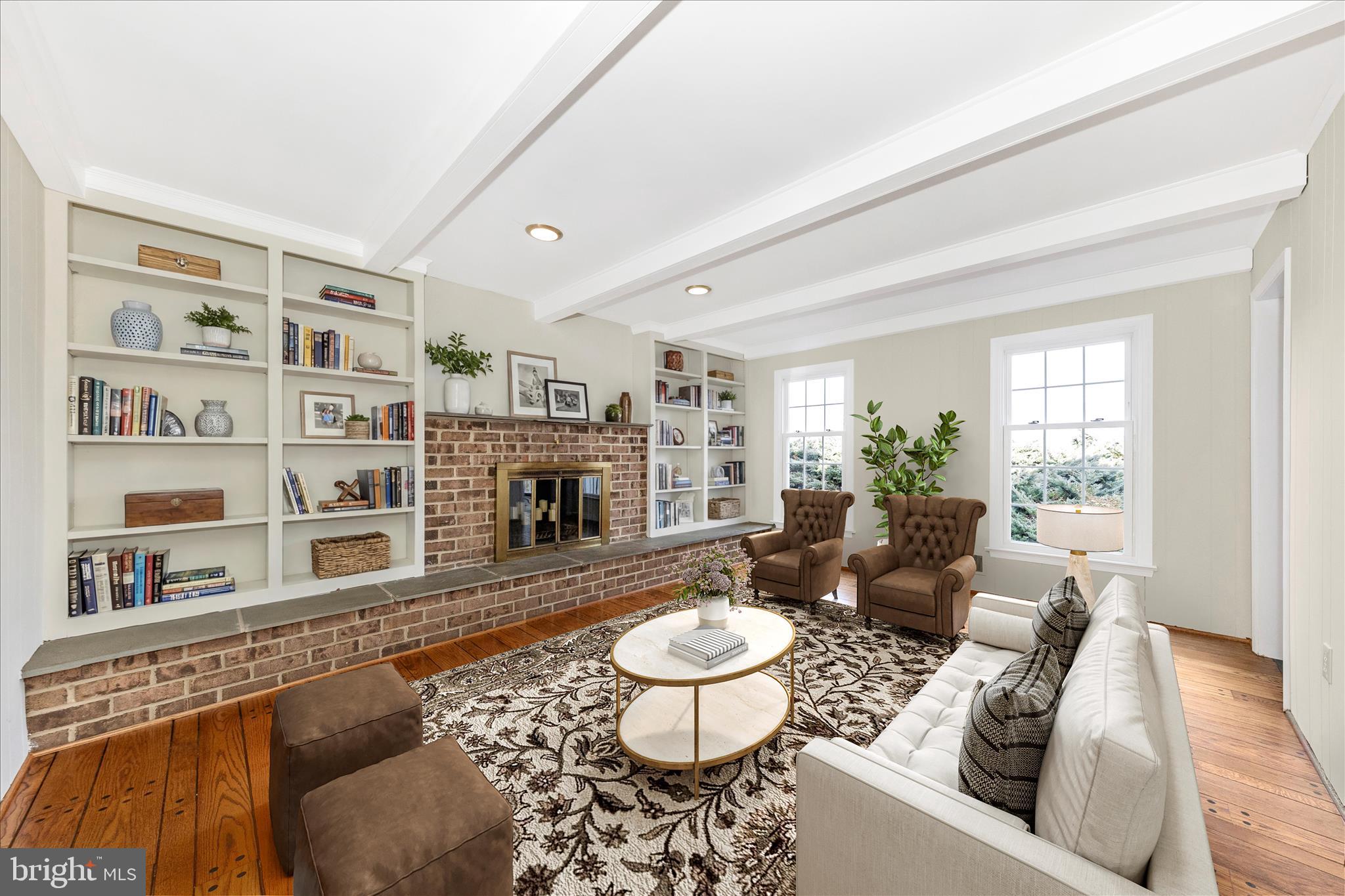 5815 Meadow Road Frederick, MD 21702 - Photo 2 of 55 a living room with furniture and a fireplace