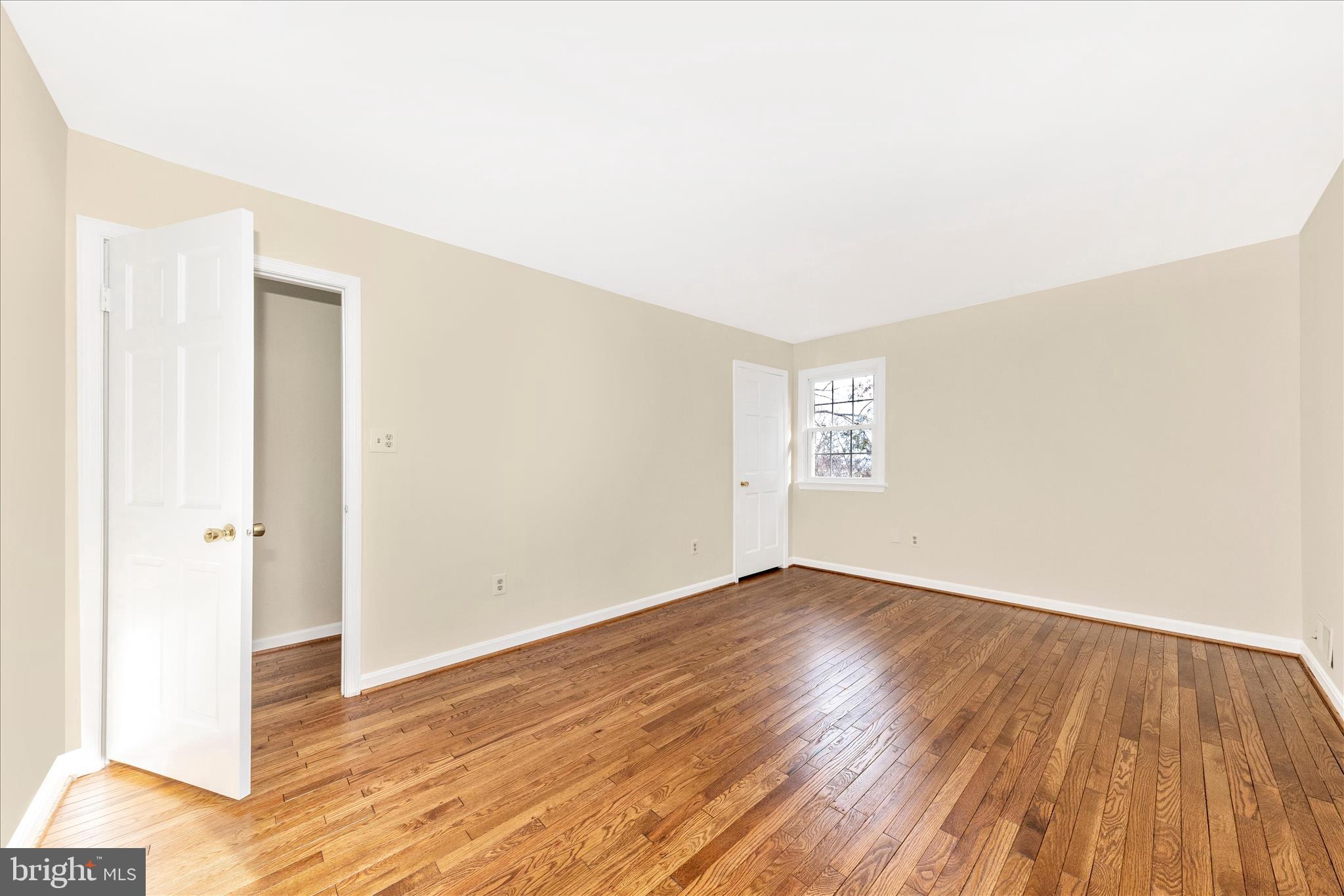 5815 Meadow Road Frederick, MD 21702 - Photo 33 of 55 an empty room with wooden floor and windows