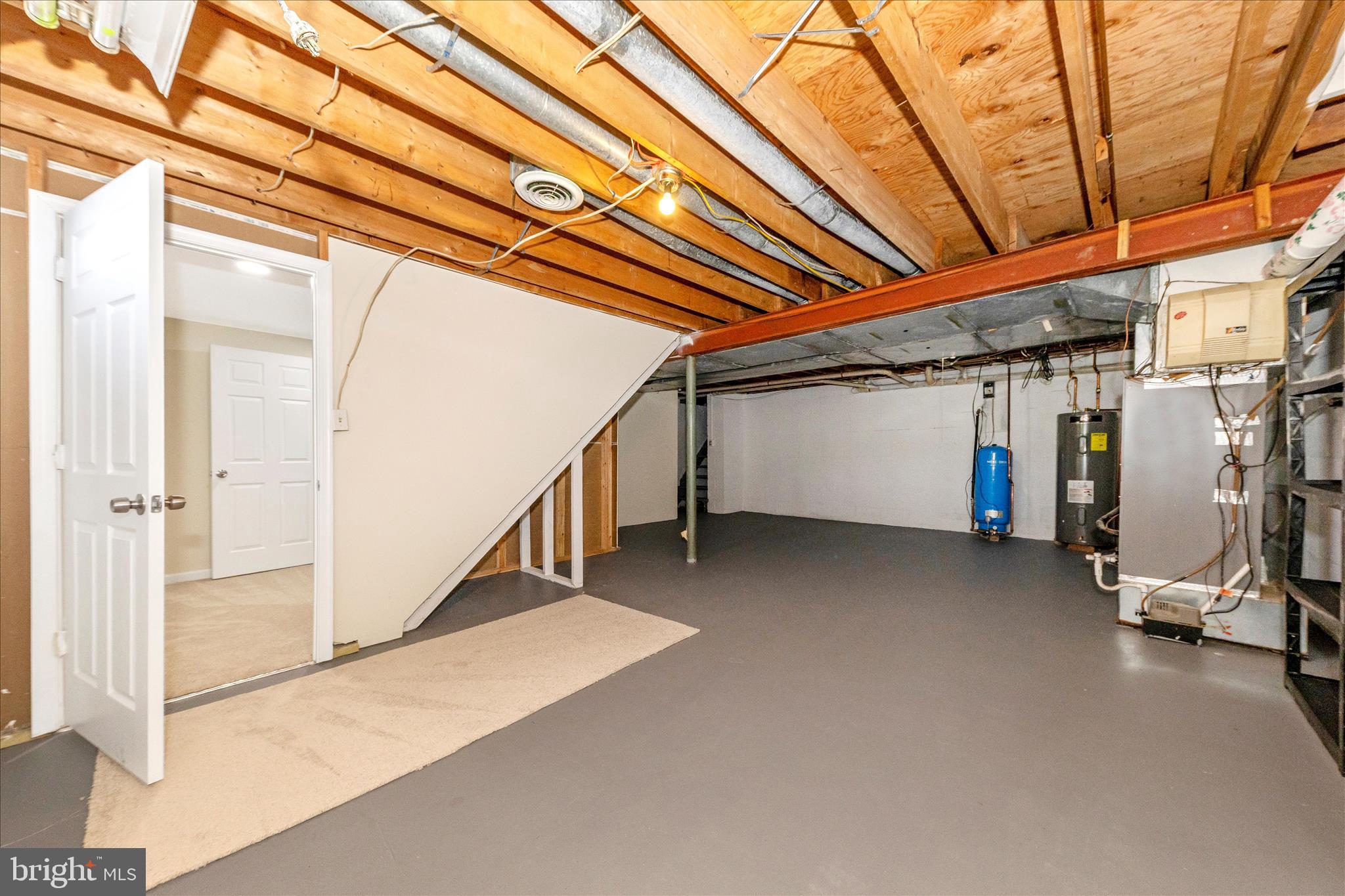 5815 Meadow Road Frederick, MD 21702 - Photo 41 of 55 a view of a storage room with stairs
