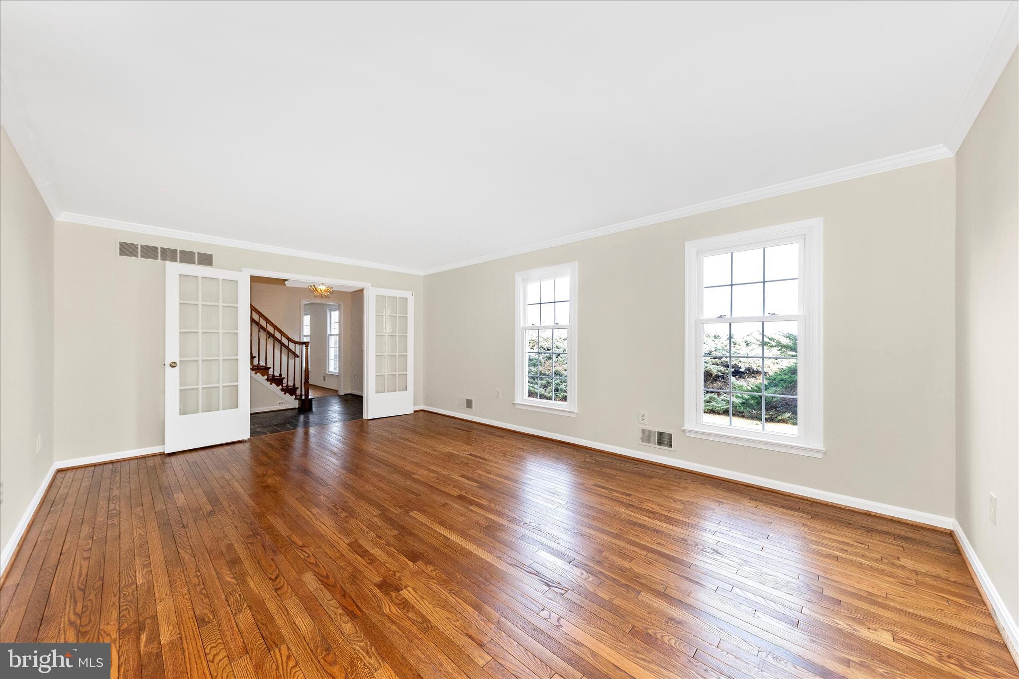 5815 Meadow Road Frederick, MD 21702 - Photo 9 of 55 an empty room with wooden floor and windows