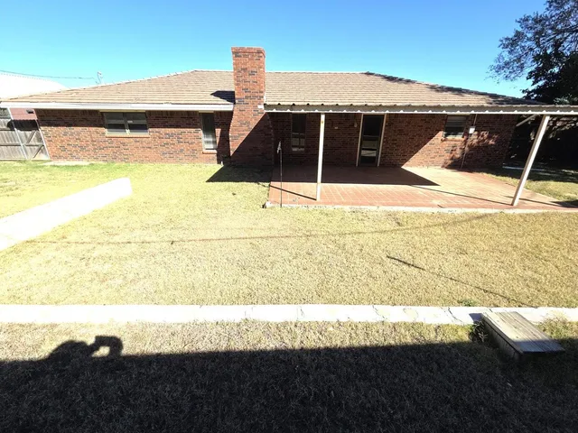 a swimming pool with a yard