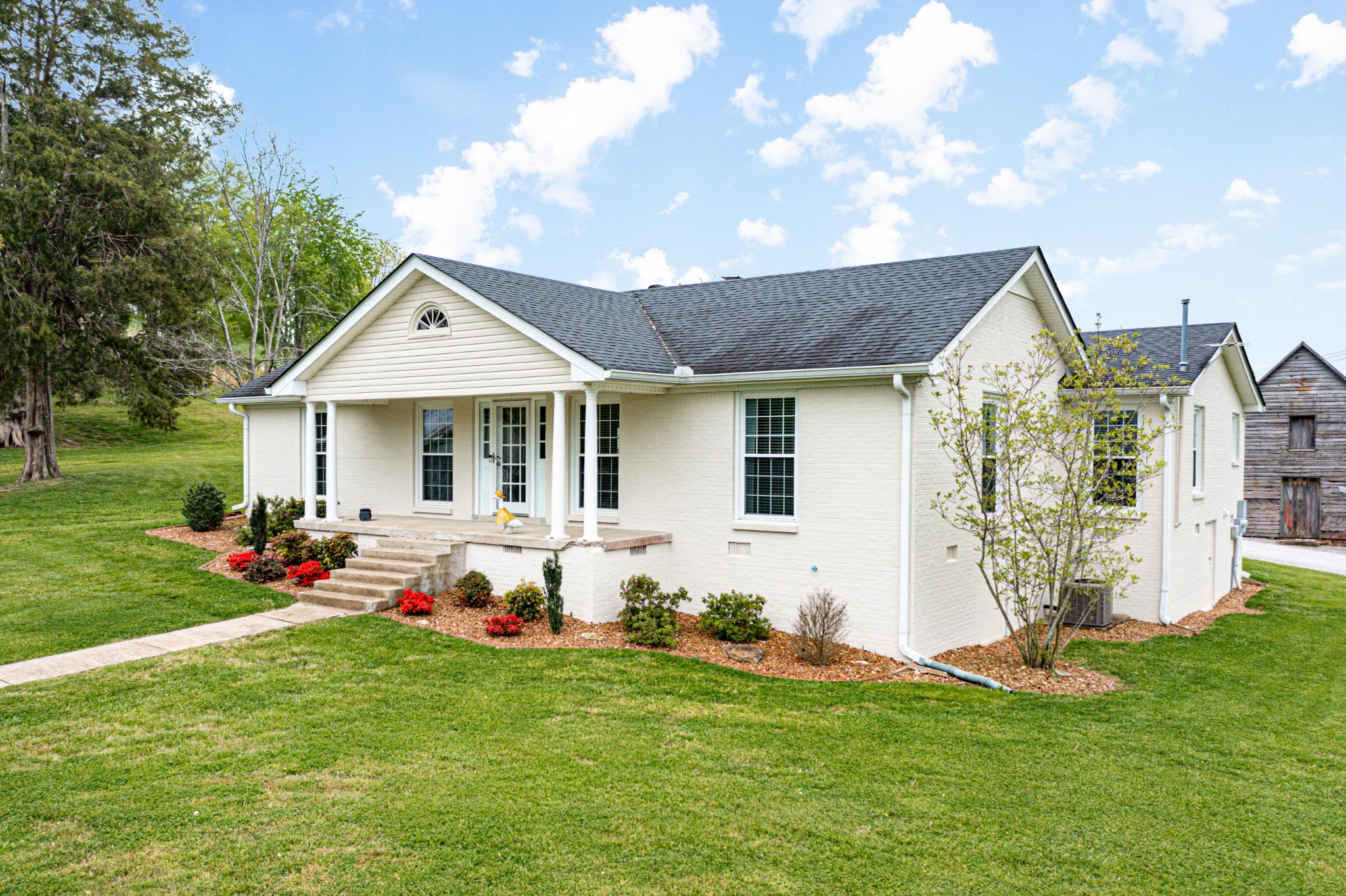 4861 Bethesda Road Thompson's Station, TN 37179 - Photo 1 of 22 a front view of house with yard and outdoor seating