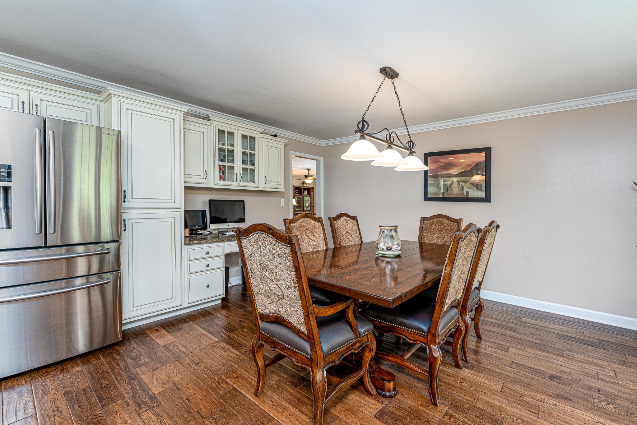 4861 Bethesda Road Thompson's Station, TN 37179 - Photo 11 of 22 a dining room with furniture a chandelier and wooden floor