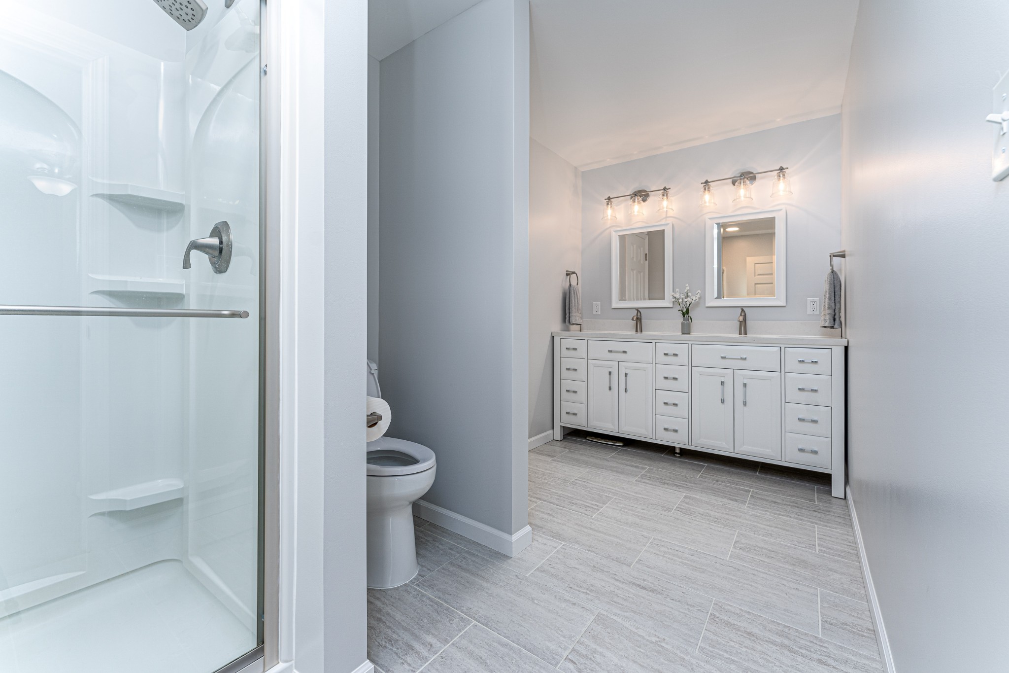 4861 Bethesda Road Thompson's Station, TN 37179 - Photo 14 of 22 a bathroom with a double vanity sink toilet and shower