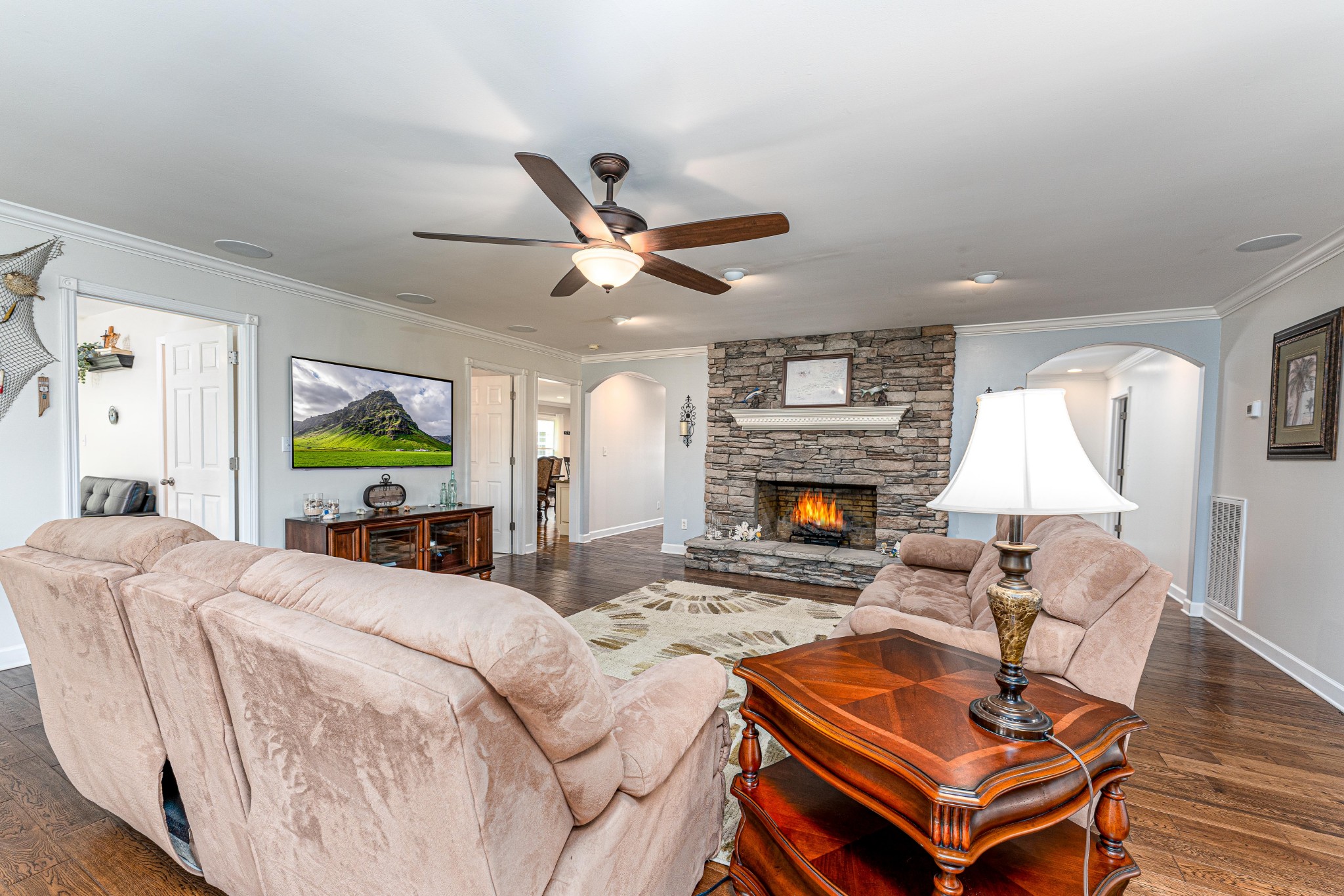 4861 Bethesda Road Thompson's Station, TN 37179 - Photo 16 of 22 a living room with furniture a fireplace and a table