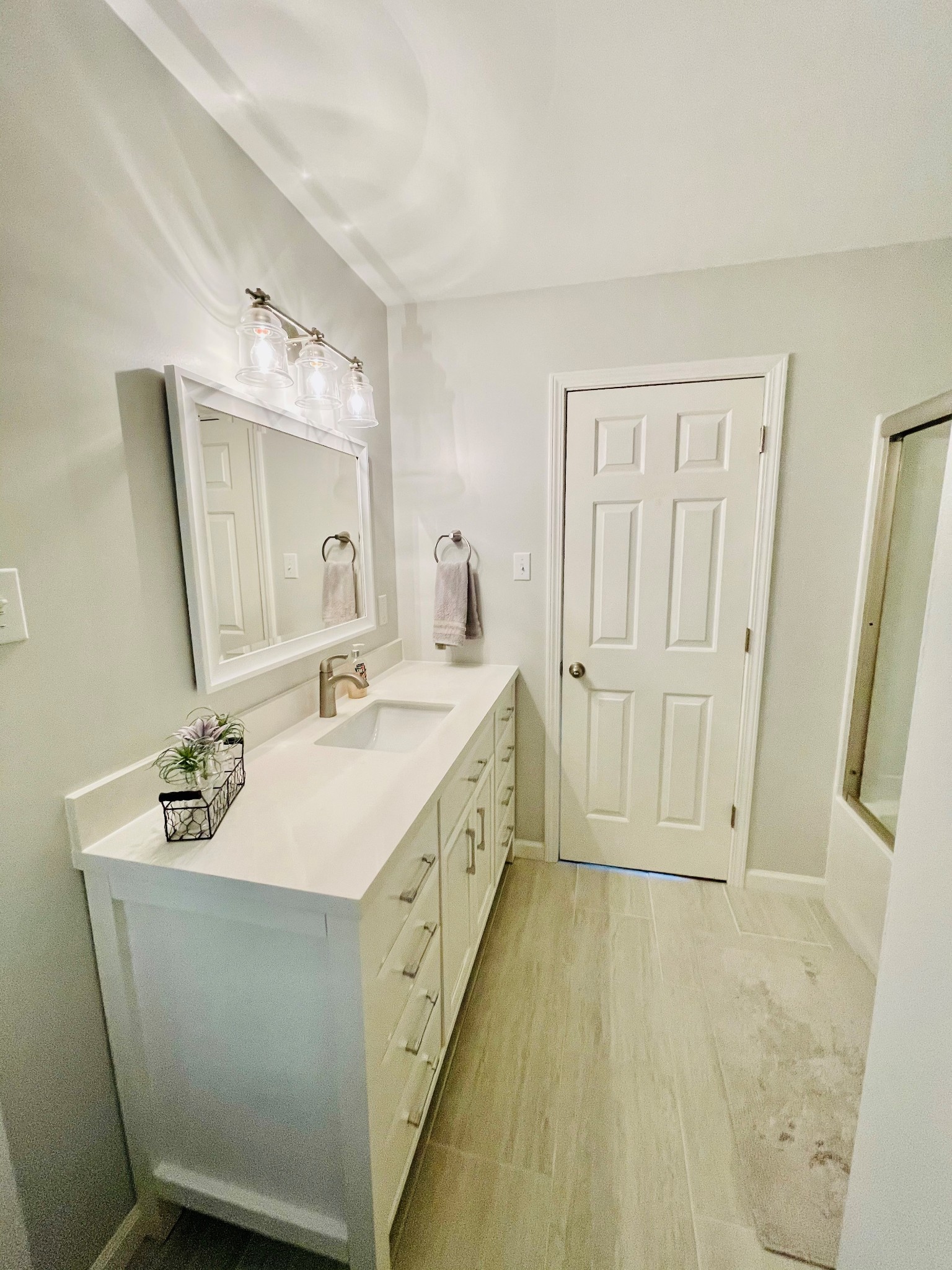 4861 Bethesda Road Thompson's Station, TN 37179 - Photo 19 of 22 a spacious bathroom with a double vanity sink and a mirror