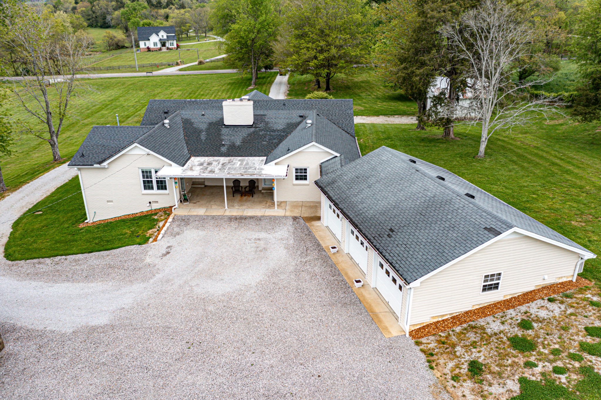 4861 Bethesda Road Thompson's Station, TN 37179 - Photo 6 of 22 an aerial view of a house with a garden and lake view