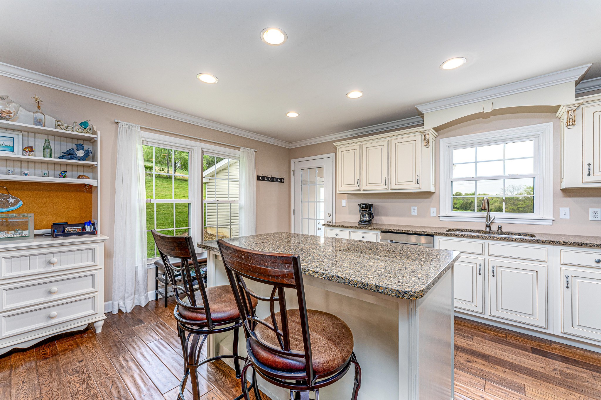 4861 Bethesda Road Thompson's Station, TN 37179 - Photo 10 of 22 a kitchen with a table chairs sink and cabinets
