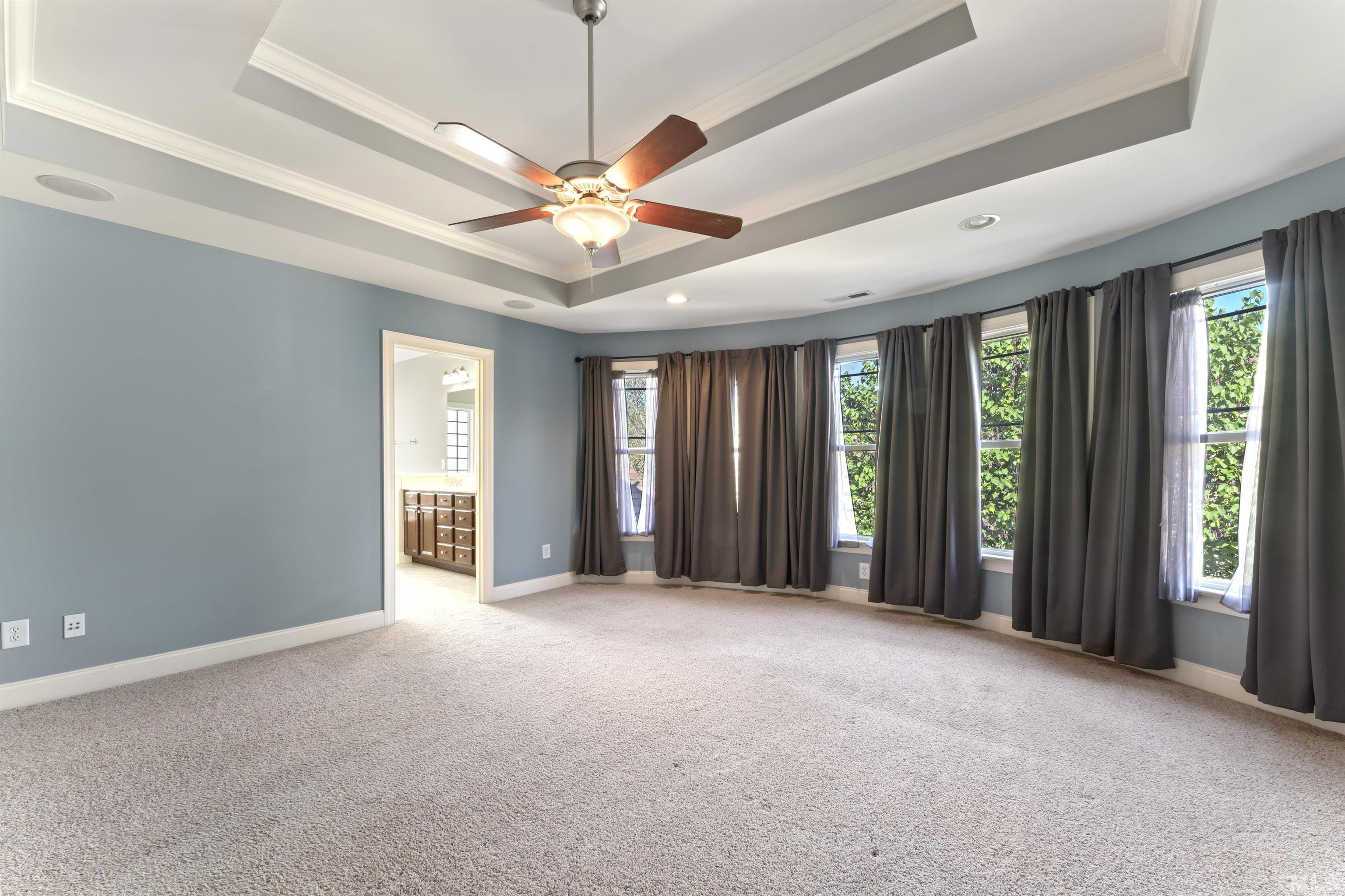 2809 Peachleaf Street Raleigh, NC 27614 - Photo 7 of 18 a view of an empty room with window and chandelier fan