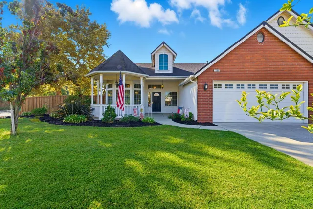 a front view of a house with garden