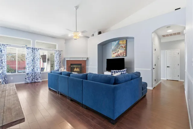 a living room with furniture and a fireplace