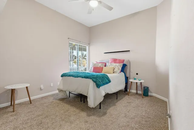 a bedroom with a bed and a chair