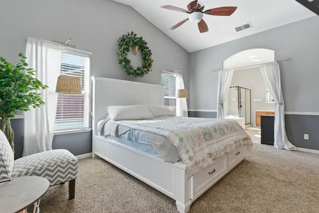 a large bathroom with a tub a double vanity sink a mirror a shower and a bathtub