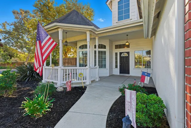 a front view of a house with a porch