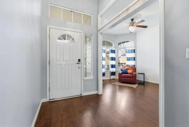 a view of a livingroom with furniture and hardwood floor