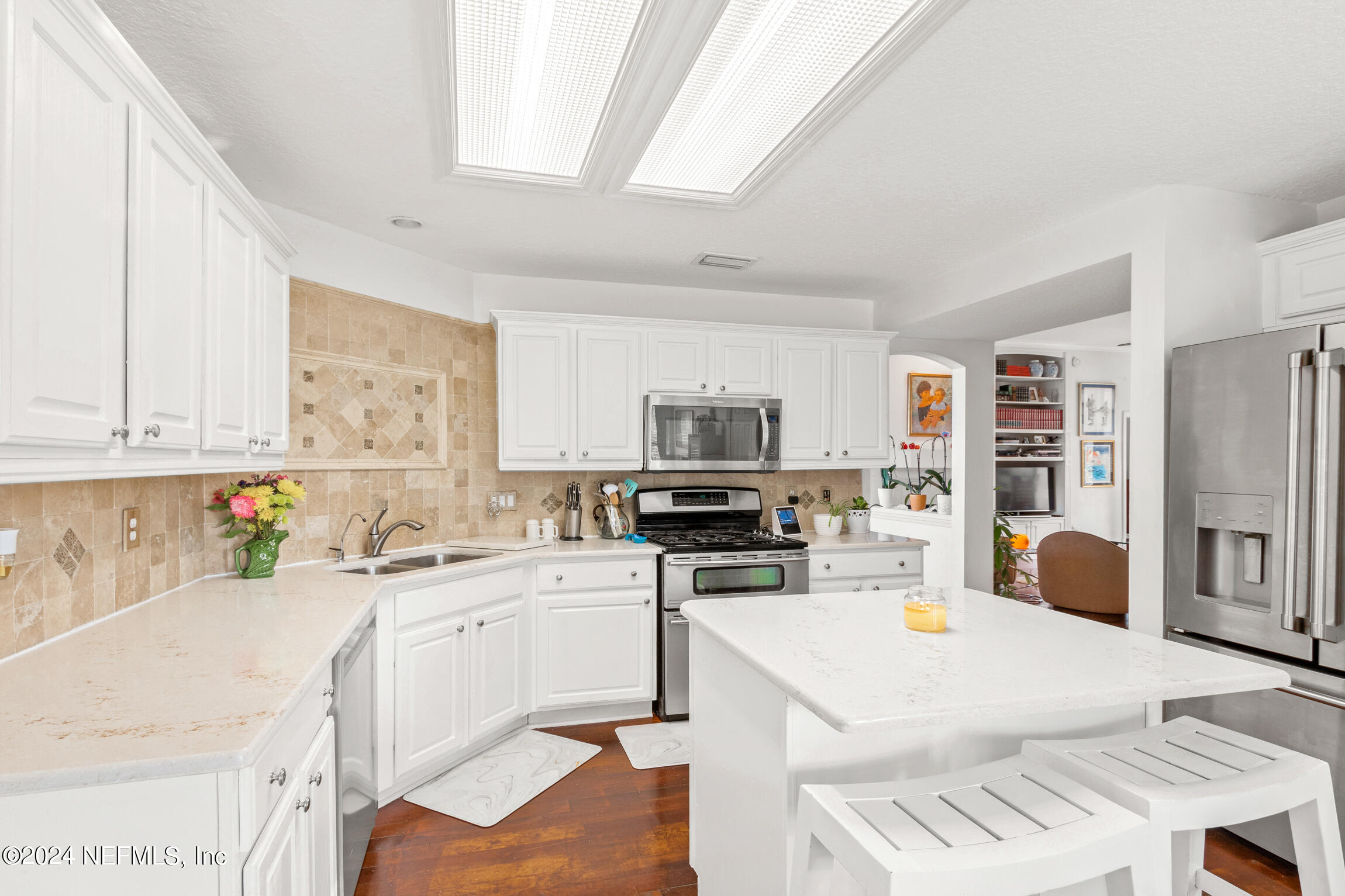 137 South Beach Drive St. Augustine, FL 32084 - Photo 19 of 41 a kitchen that has a cabinets and a stove in it