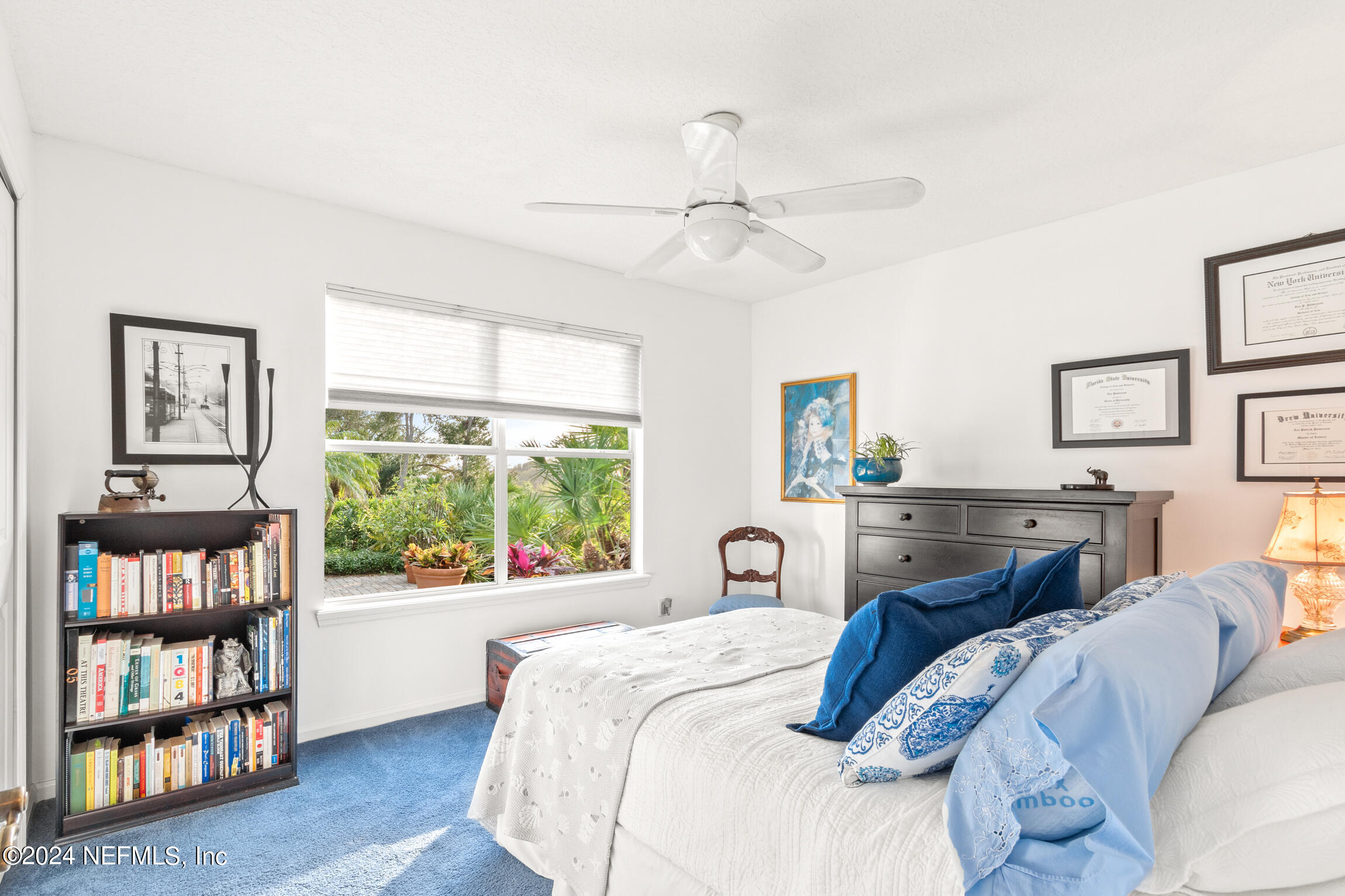 137 South Beach Drive St. Augustine, FL 32084 - Photo 22 of 41 a bedroom with a bed a dresser and a large window