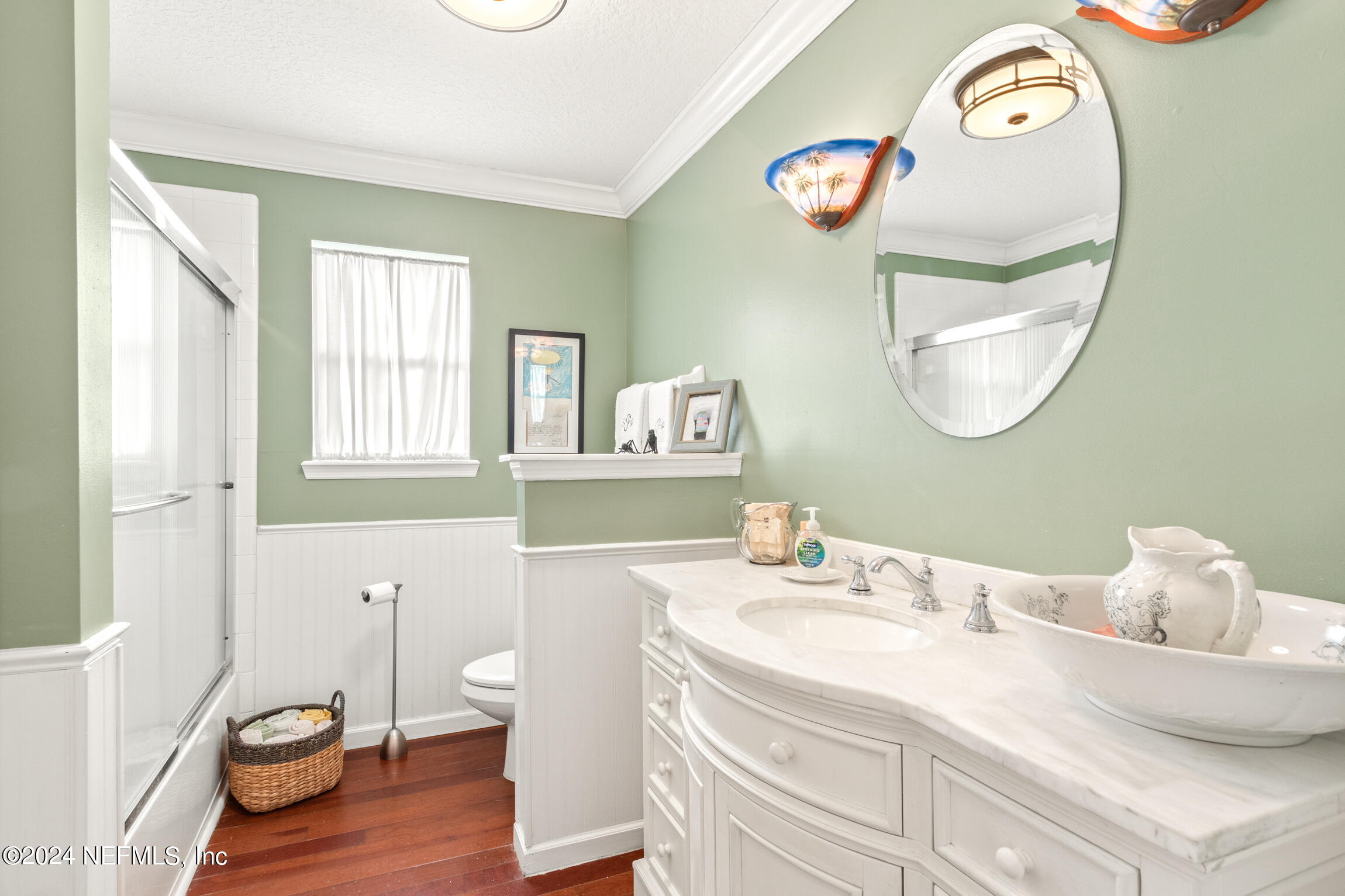 137 South Beach Drive St. Augustine, FL 32084 - Photo 23 of 41 a bathroom with a sink mirror and toilet