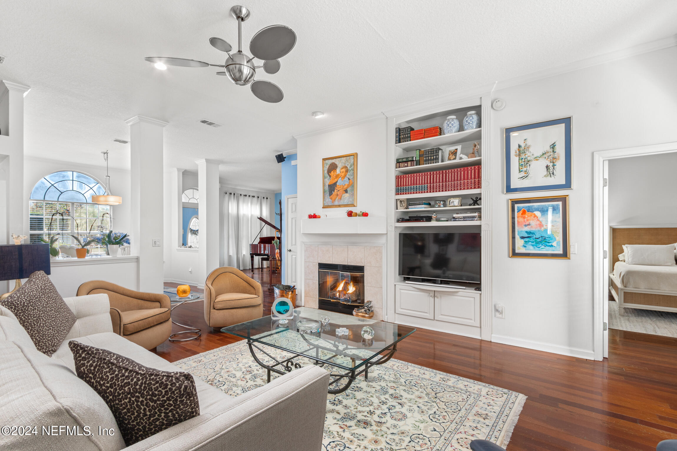 137 South Beach Drive St. Augustine, FL 32084 - Photo 7 of 41 a living room with furniture a fireplace and wooden floor