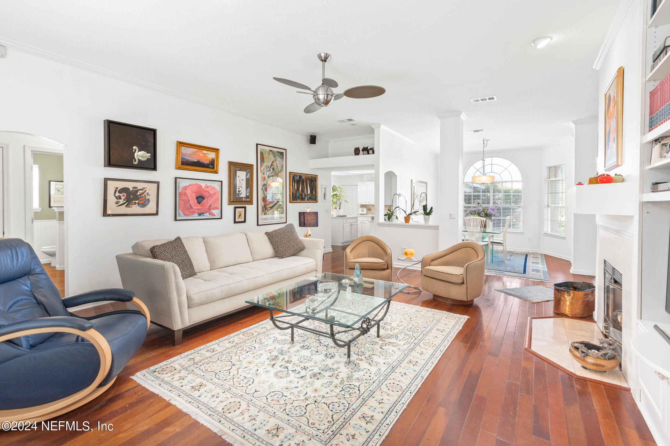 137 South Beach Drive St. Augustine, FL 32084 - Photo 8 of 41 a living room with furniture a rug and a chandelier