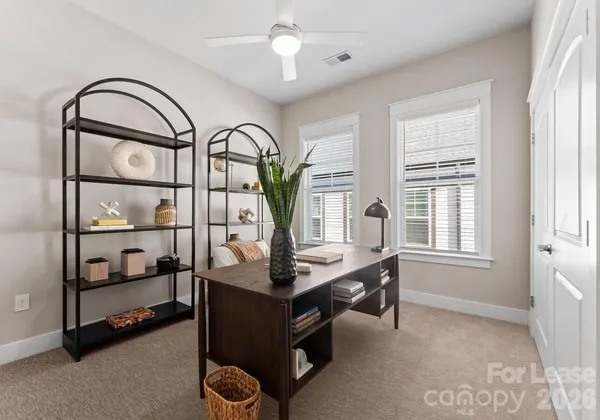 a view of a livingroom with furniture and window