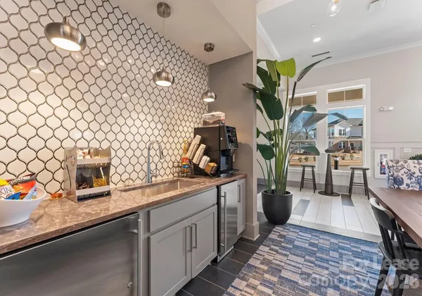 a kitchen with sink cabinets and wooden floor