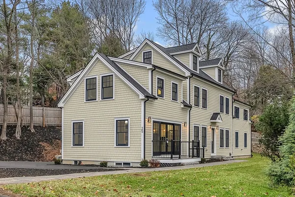 a front view of a house with a yard