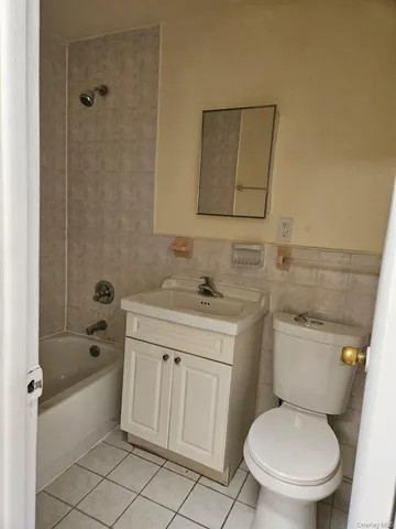 a bathroom with a toilet sink and shower