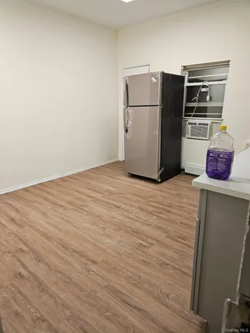 a kitchen with stainless steel appliances a refrigerator and a stove