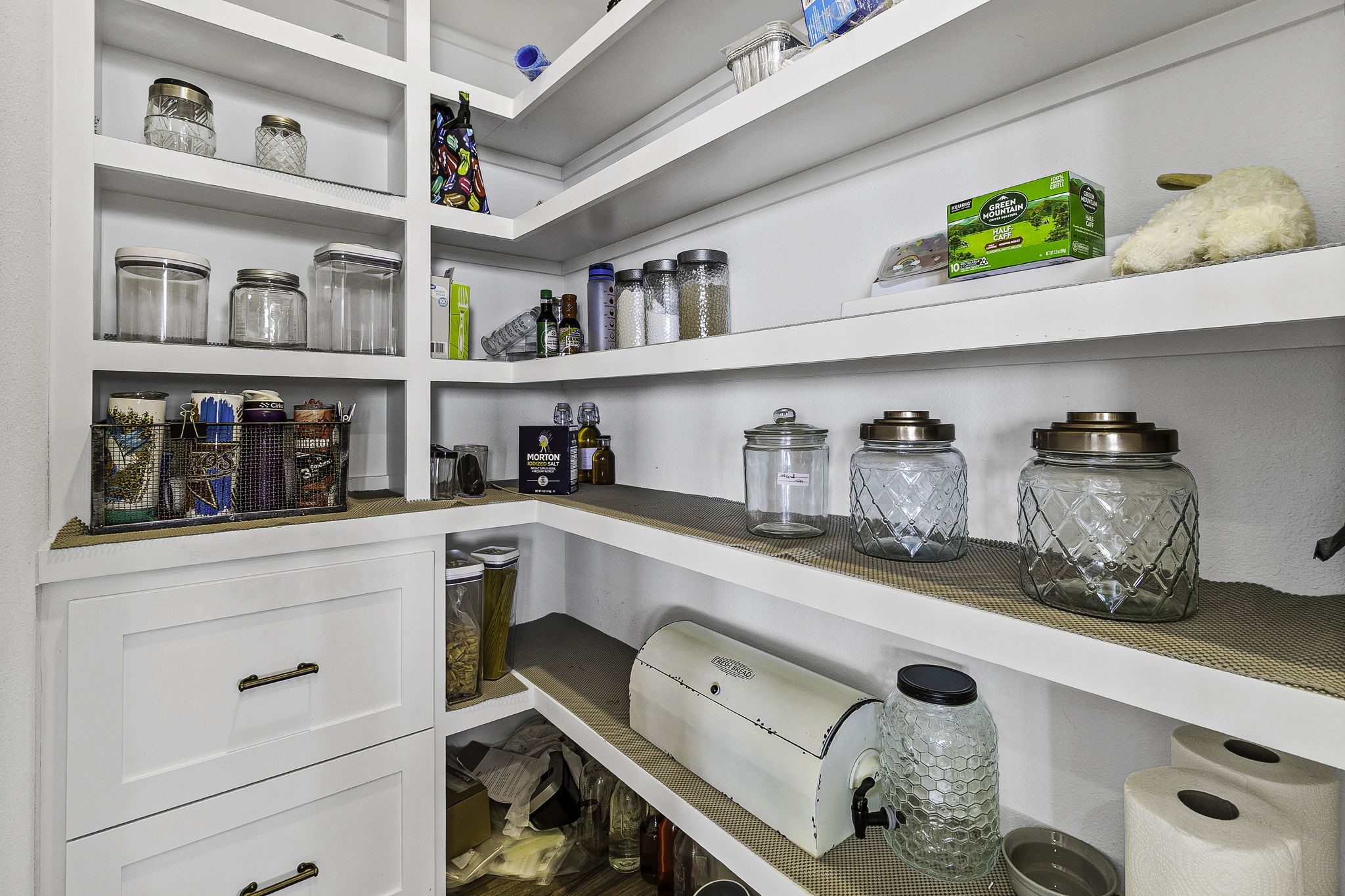 151 Key Largo Loop Point Blank, TX 77364 - Photo 15 of 49 Spacious walk-in pantry with custom shelving, built-in storage, and ample space to keep everything organized and within reach.