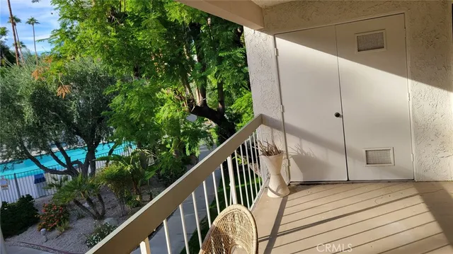a view of balcony with wooden floor