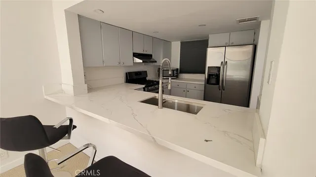 a view of living room with furniture and lamp
