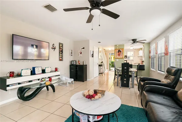 a living room with furniture and a flat screen tv