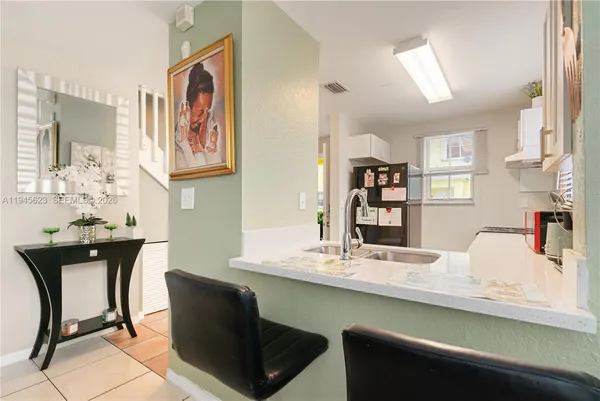 a dining room with furniture and window