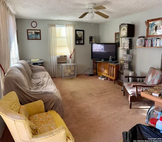 a living room with lots of furniture and appliances