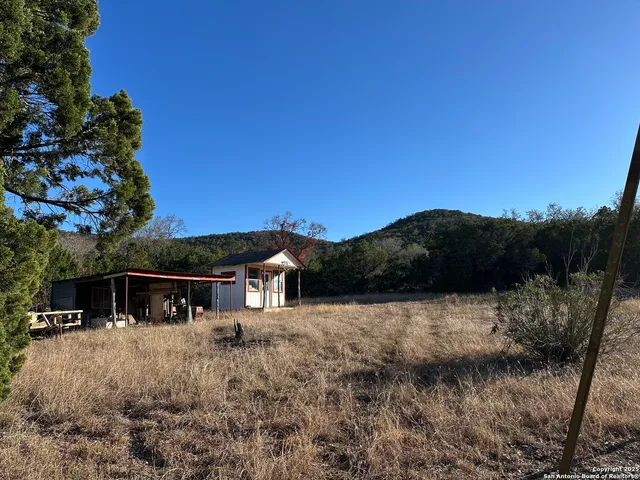 a view of house with a yard