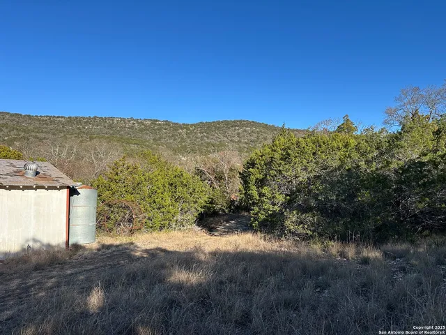 a view of a large building with a mountain in the background