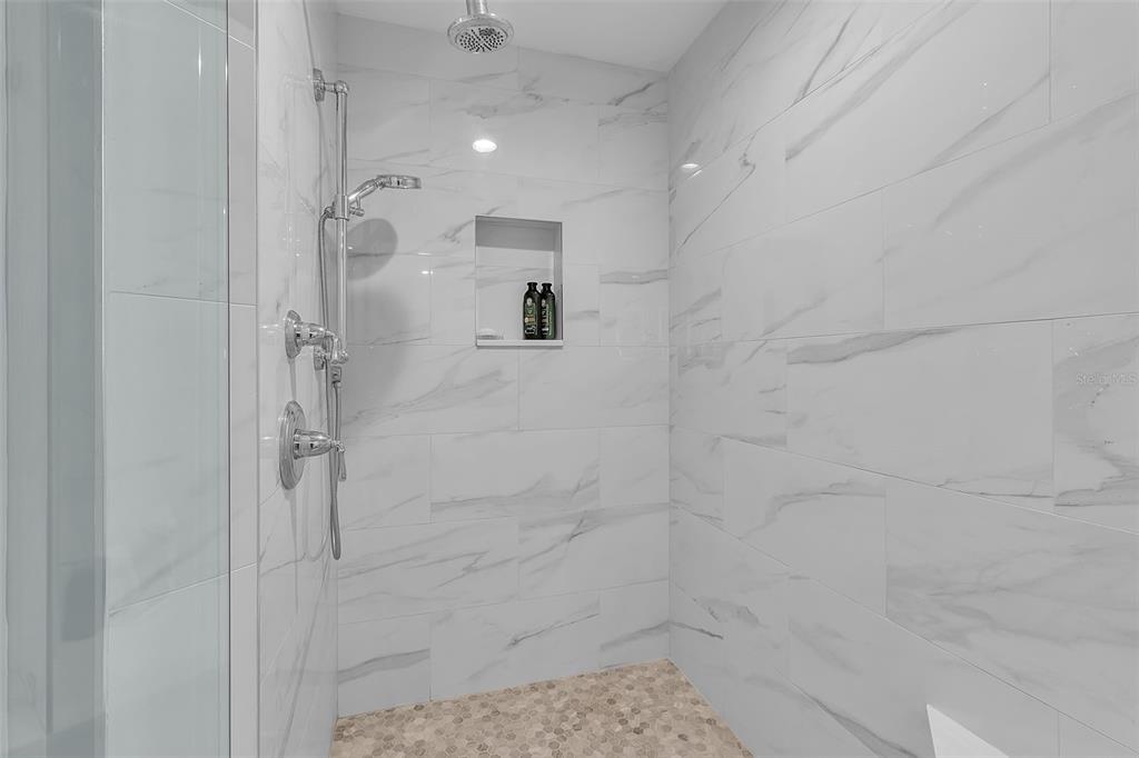 393 North Point Road, Unit 401 Osprey, FL 34229 - Photo 52 of 62 a bathroom with a shower