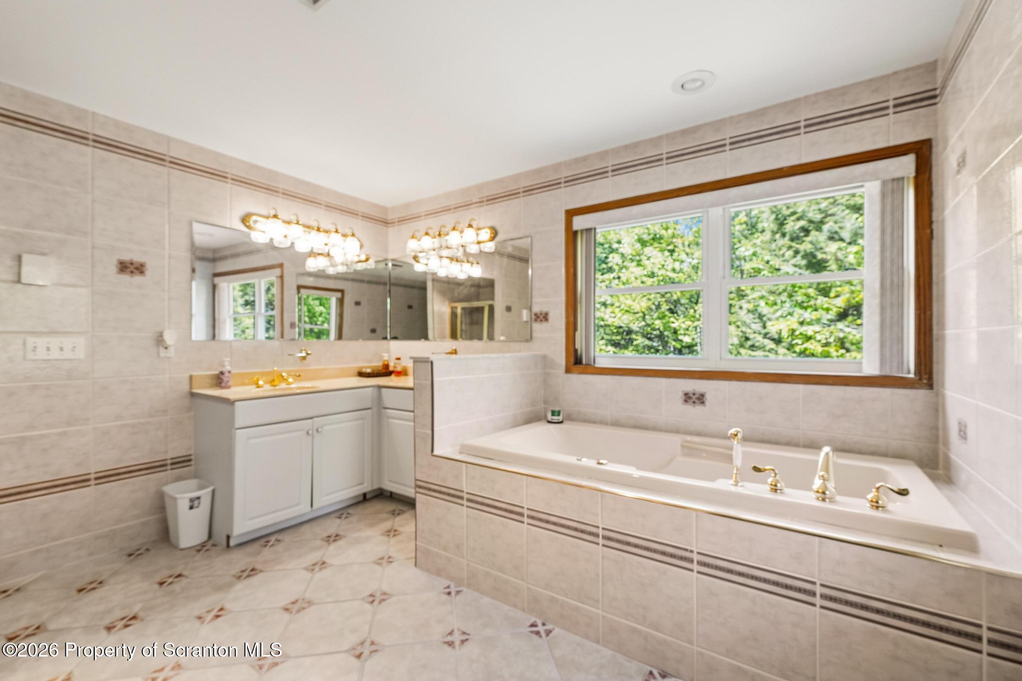 58 Bender Road Gouldsboro, PA 18424 - Photo 22 of 55 a bathroom with a sink and a bathtub