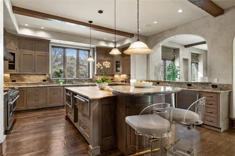 a kitchen with a sink cabinets and window