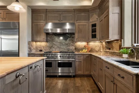 a kitchen with a stove and a sink