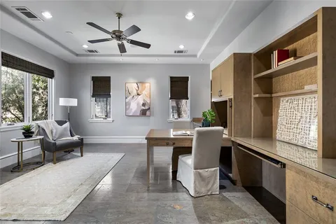 a living room with furniture a window and a chandelier