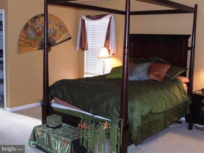 1307 Stallion Street Ranson, WV 25438 - Photo 11 of 22 a bedroom with a bed and a window