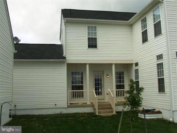 1307 Stallion Street Ranson, WV 25438 - Photo 20 of 22 a view of a house with a yard
